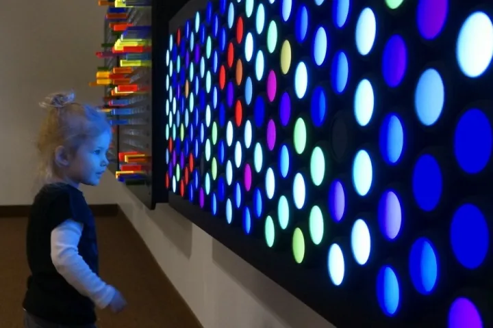 a person standing in front of a computer