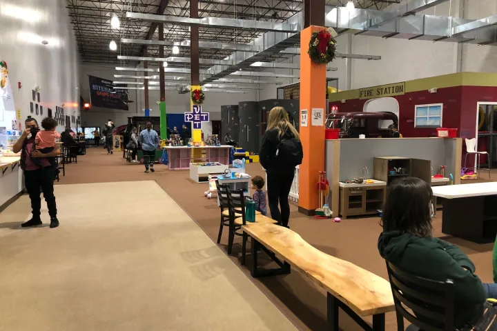 a group of people sitting at a train station