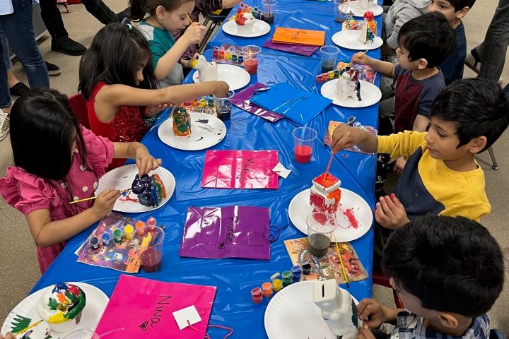 a group of kids painting for a birthday party