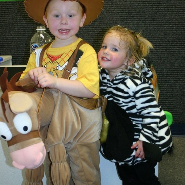a small child is holding a stuffed animal