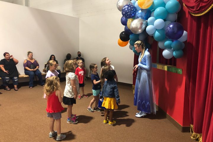 a group of people standing in a room