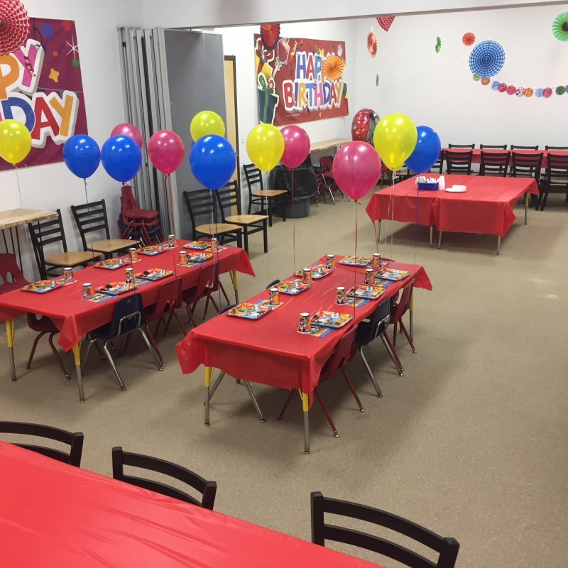 a group of people sitting at a table in a room