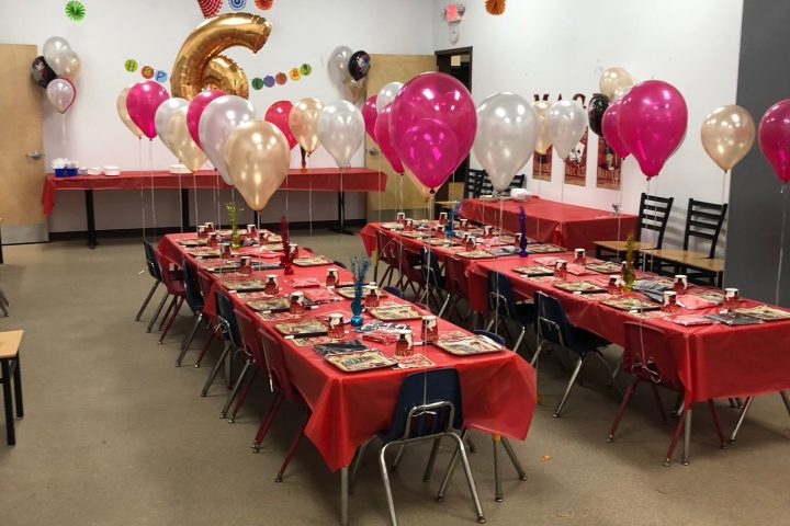 a group of people sitting at a table in a room