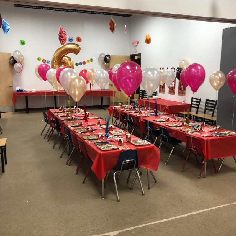 a group of people sitting at a table in a room