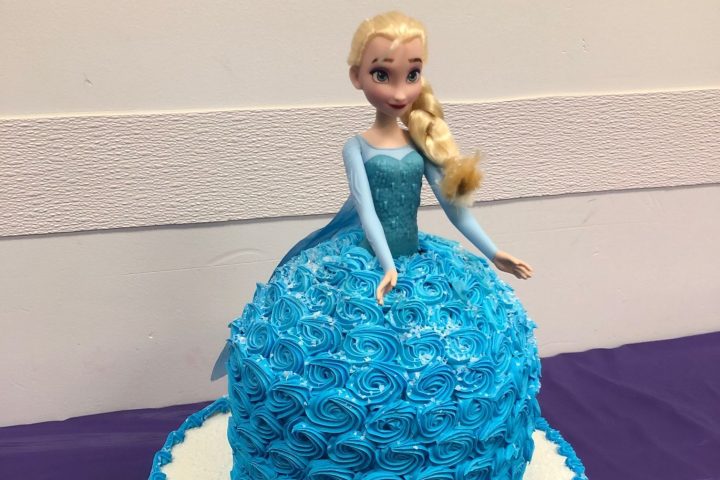 a blue and white cake on a table