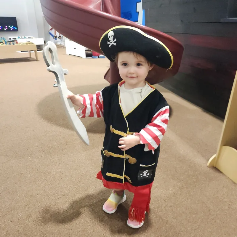 a little boy wearing a hat